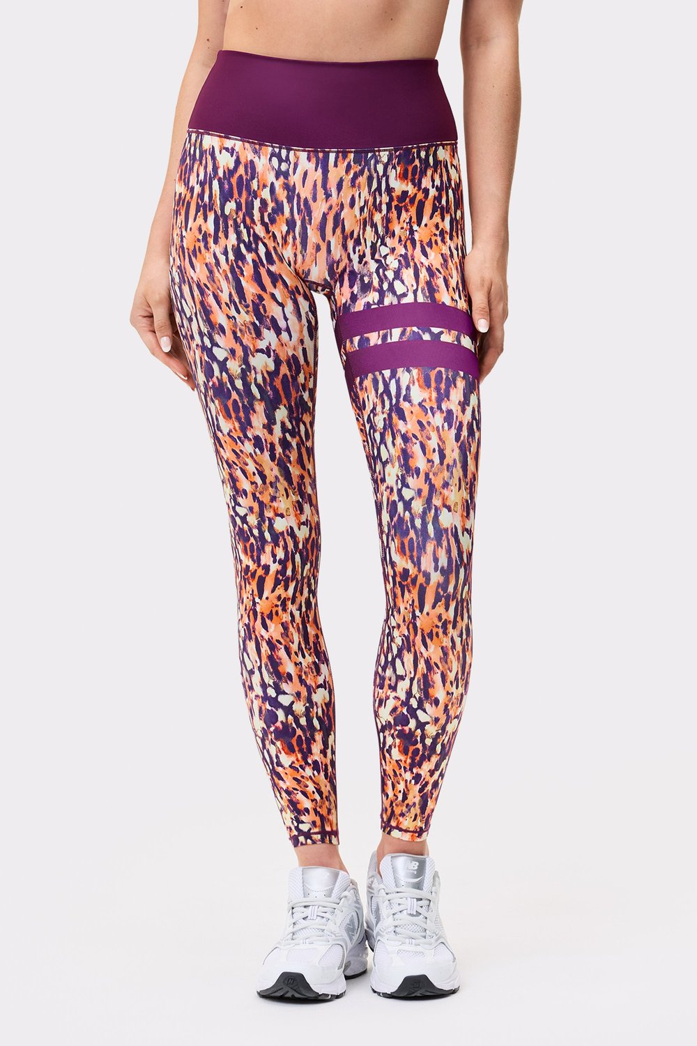 Front view of a model in Stronger The Signature One Leggings in Malibu Milk Print showing signature lines.