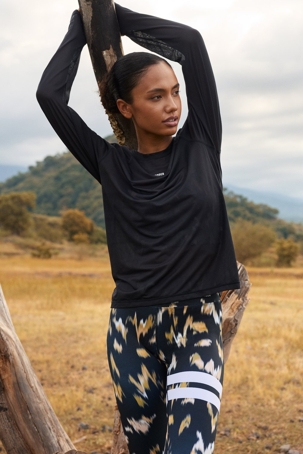 Stronger black Mesh Running Long Sleeve in a loose fit, featuring breathable mesh fabric for outdoor workouts.