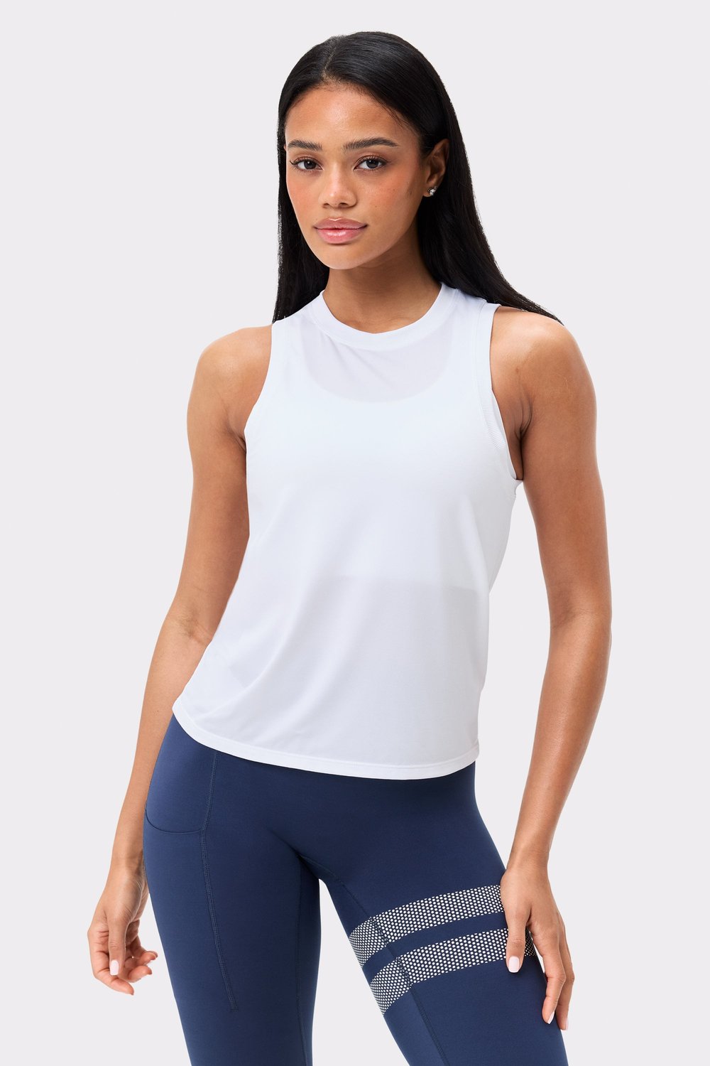 Front view of the Stronger Relaxed Tank in bright white, featuring a loose fit and breathable recycled fabric.