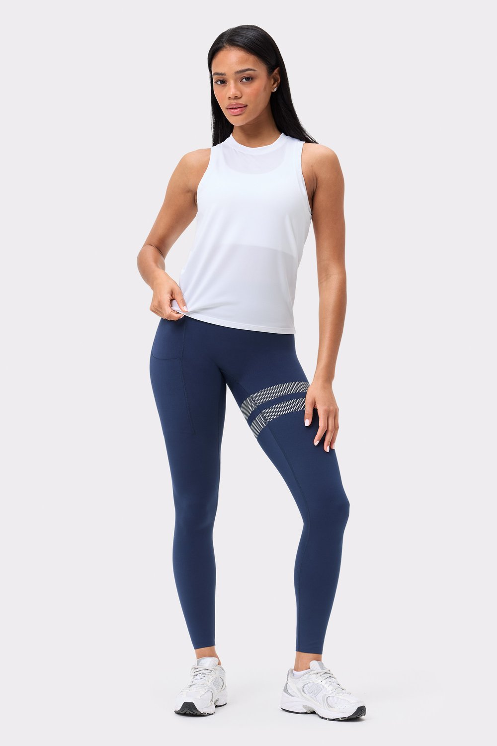 Front view of the Stronger Relaxed Tank in Bright White, a breathable and lightweight top for gym and training.