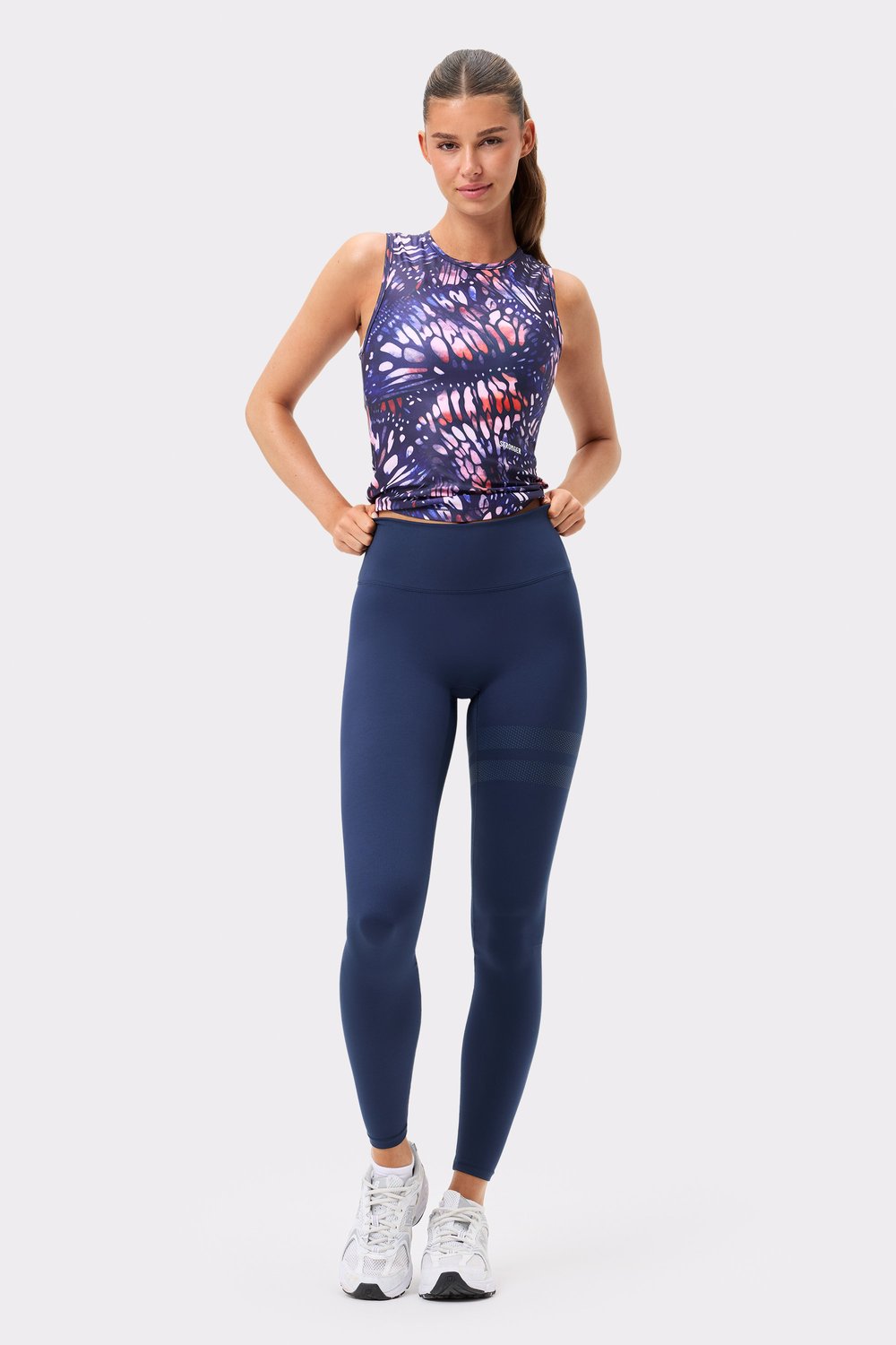 Stronger Signature Slim Tank Top in Dark Butterfly print, a slim-fit active tank with a navy and pink pattern.