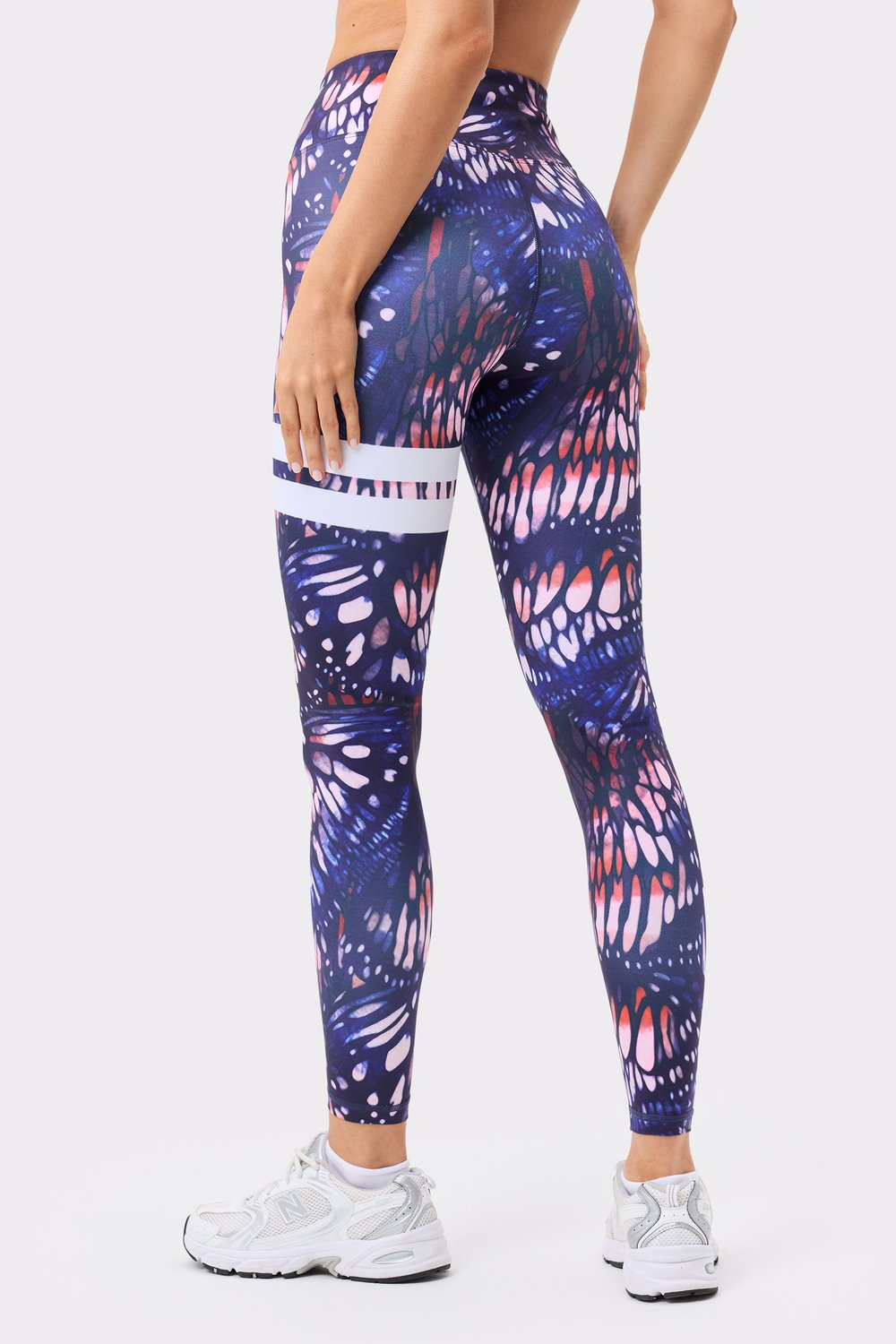 Stronger's Explore Printed Leggings in dark butterfly print, featuring signature white stripes and a high waist.