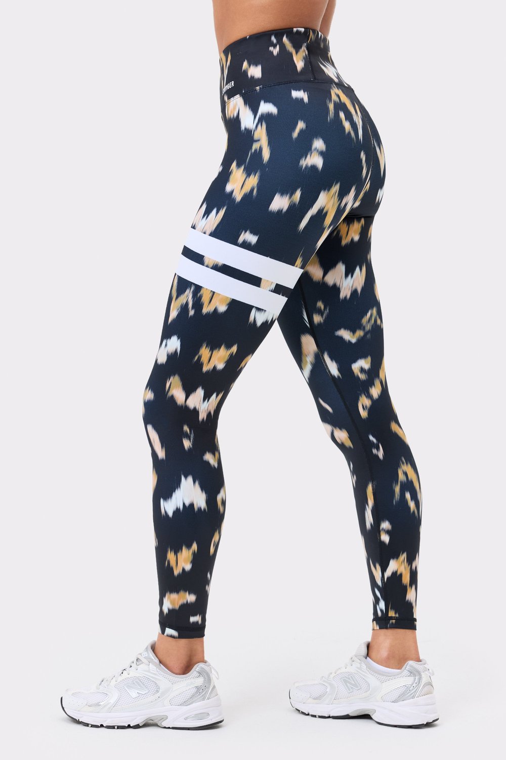 Stronger Explore Printed Leggings in Savannah Print featuring signature white stripes and high-waisted fit.