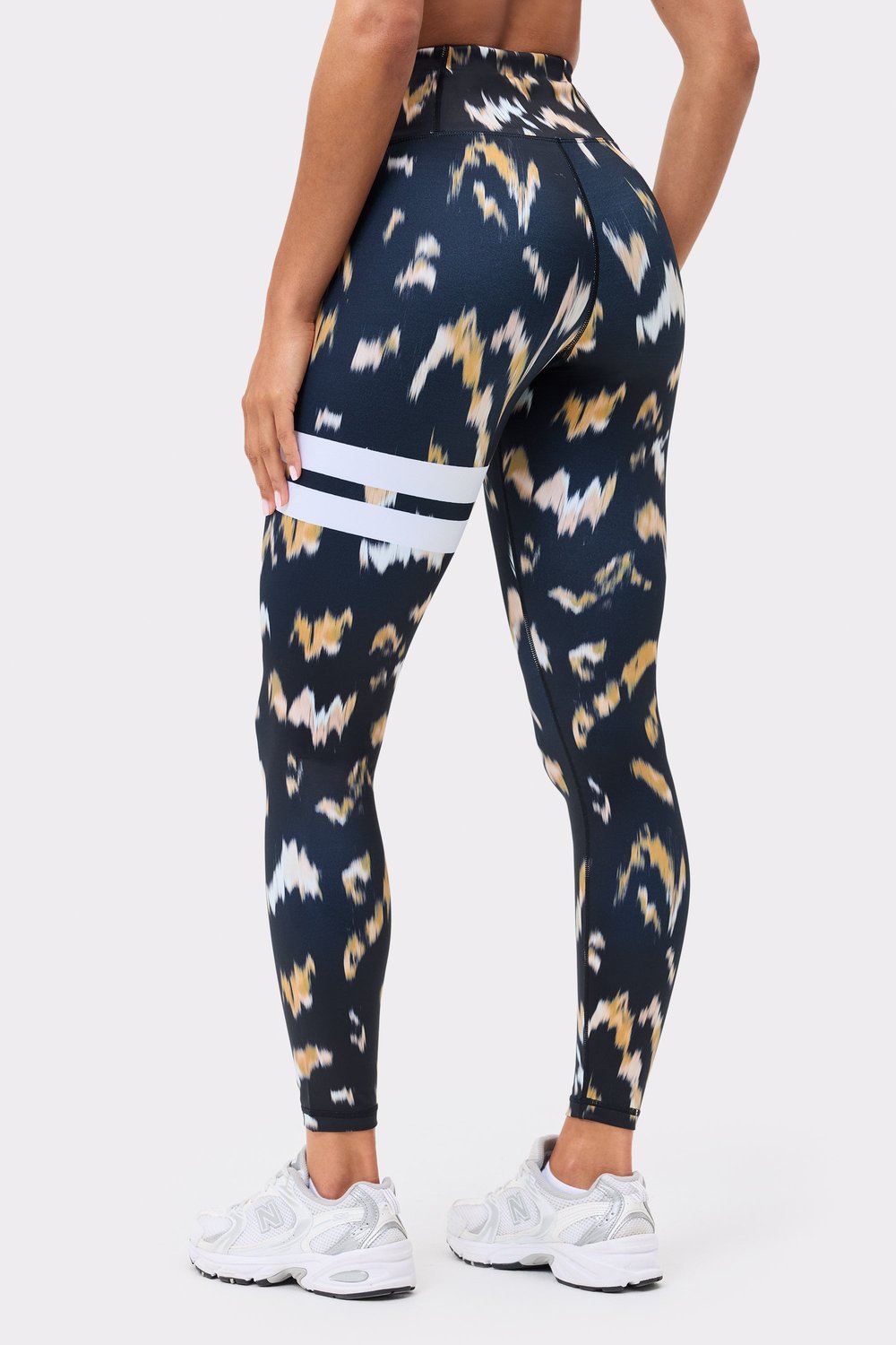 Stronger Explore Printed Leggings in Savannah Print featuring a multicolour pattern and signature white thigh stripes.