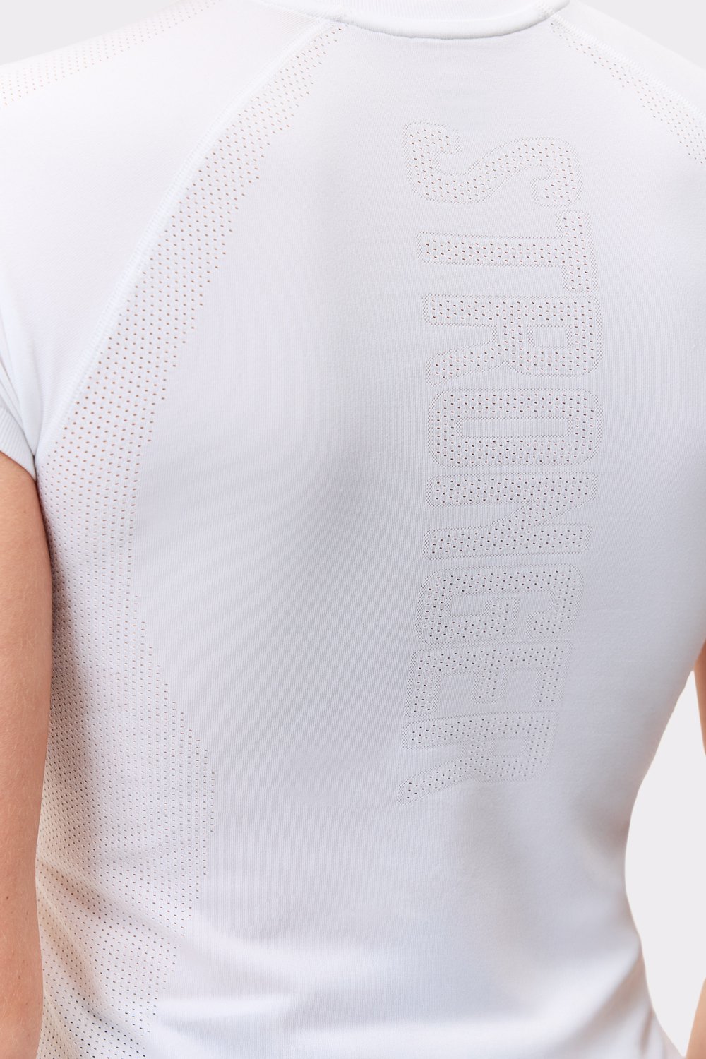 Close-up of the white Seamless Performance T-shirt, featuring a breathable perforated Stronger logo on the back.