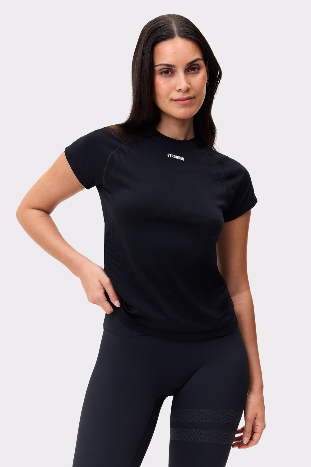 Front view of Stronger's black Seamless Performance T-shirt, a slim-fit, breathable top featuring a white chest logo.
