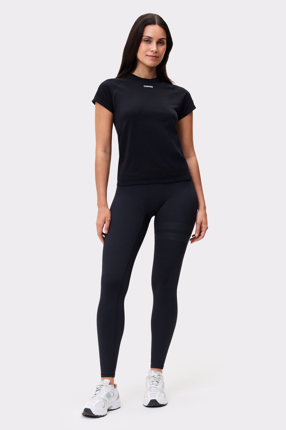Front view of the black Seamless Performance T-shirt by Stronger, featuring a slim fit and breathable, recycled fabric.