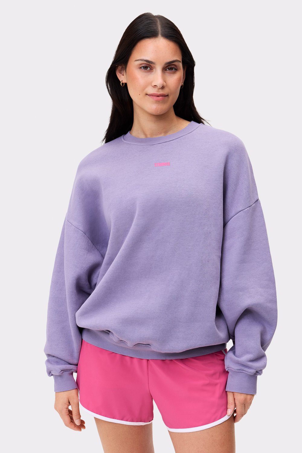 Oversized Stronger Comfy Washed Sweatshirt in vintage violet with a soft washed out look and small logo on the chest.