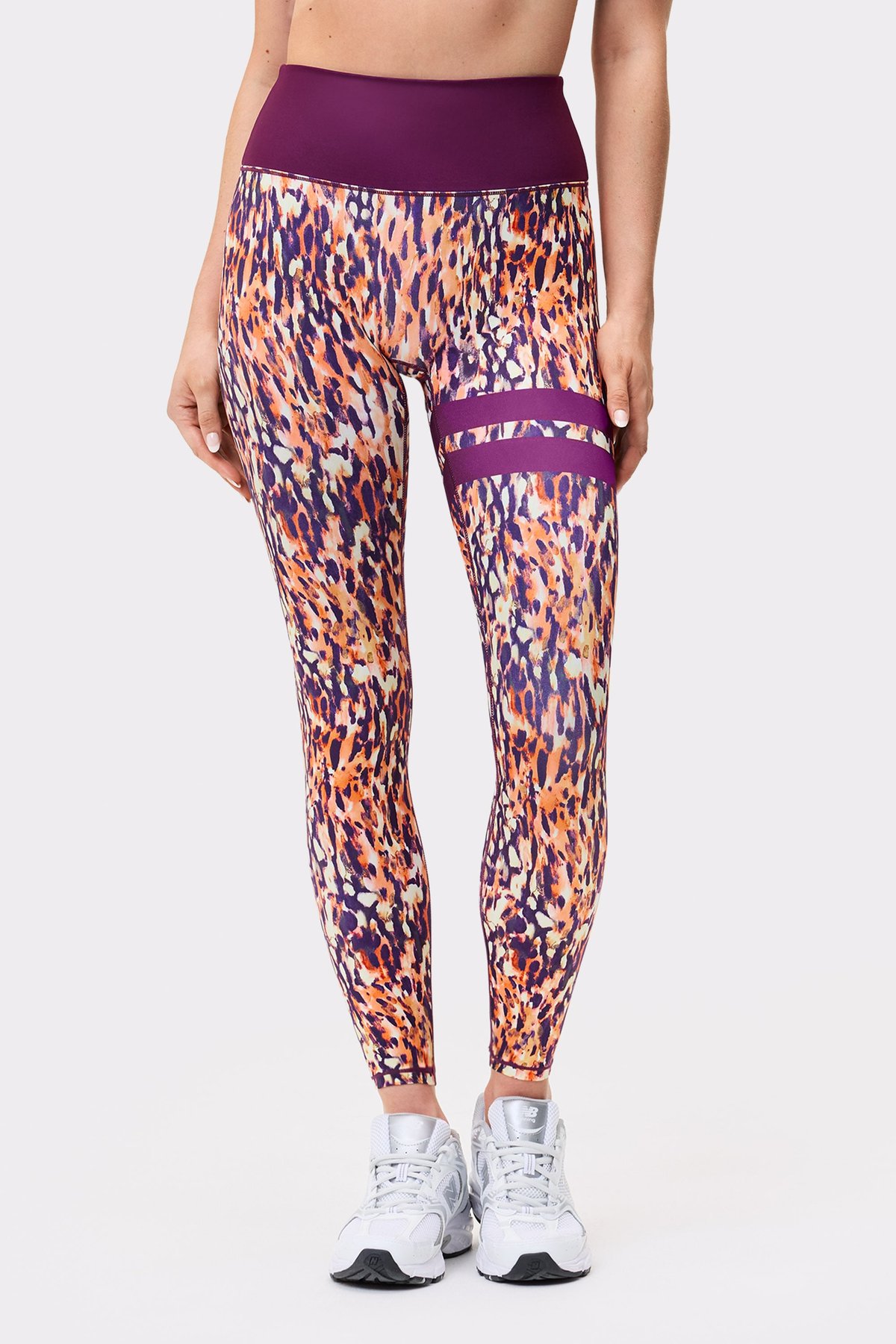 Front view of a model in Stronger The Signature One Leggings in Malibu Milk Print showing signature lines.