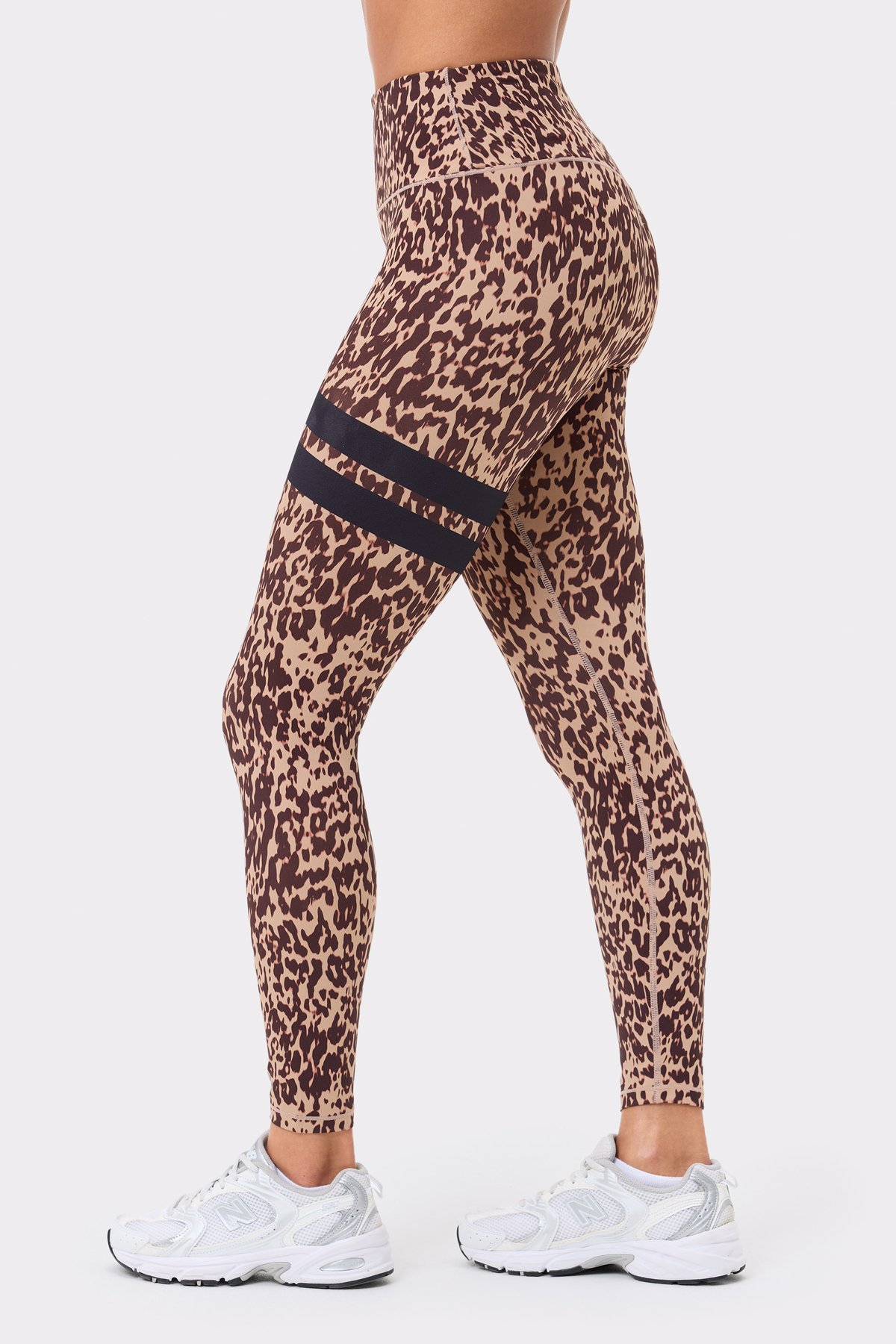 Stronger's The Signature One Leggings in light brown Leo Rush print, featuring black signature stripes in a side view.