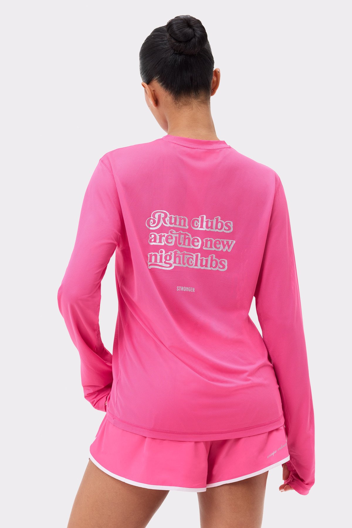 Pink Mesh Running Long Sleeve from Stronger, shown from the back with a reflective graphic and breathable mesh detail.