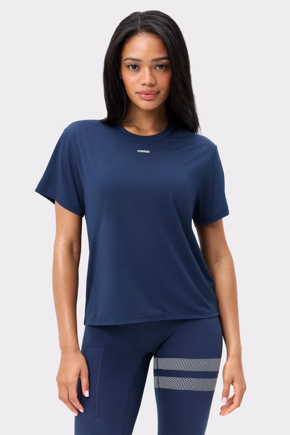 Front view of Stronger's dark blue Relaxed Tee, featuring a small chest logo and a breathable, relaxed fit.