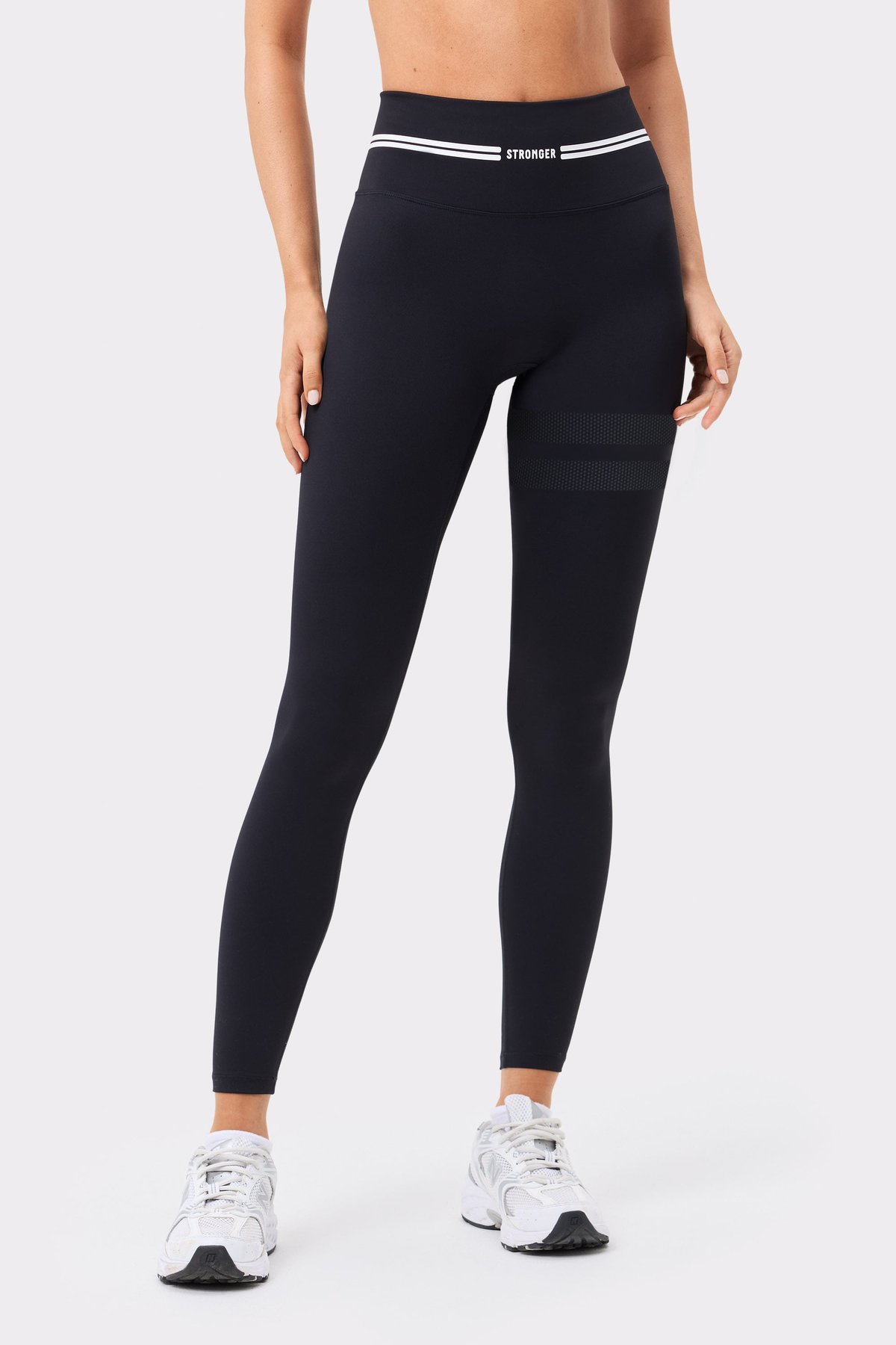 Front view of Stronger's black Signature Logo Leggings, featuring signature stripes and a high-waisted fit.
