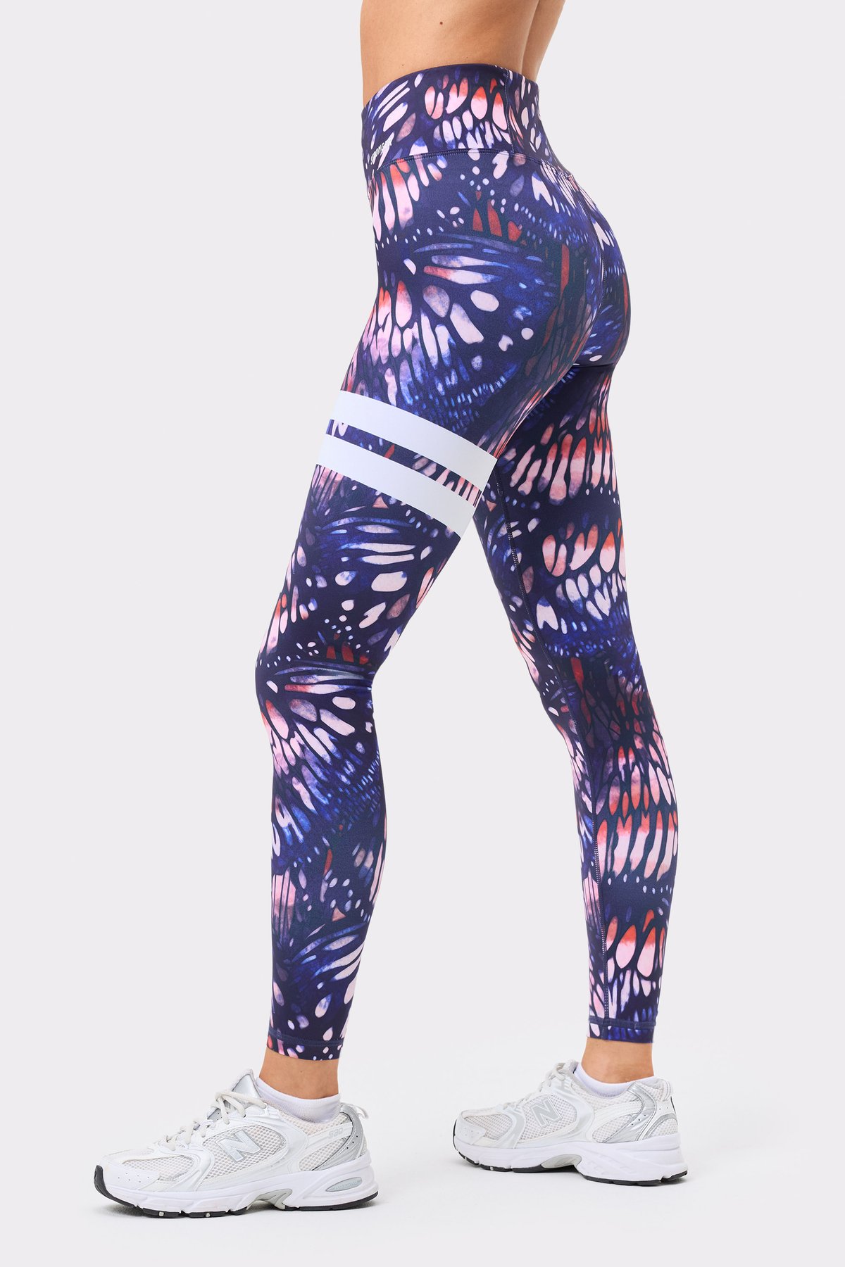 Stronger's high-waisted Explore Printed Leggings in a dark pink butterfly print with white signature stripes.
