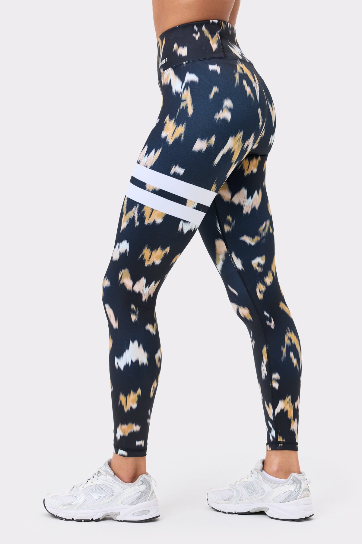 Stronger Explore Printed Leggings in Savannah Print featuring signature white stripes and high-waisted fit.