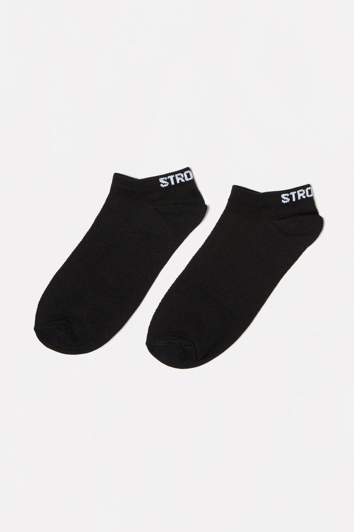 Close-up of the black Sporty Socks from Stronger, featuring a breathable knitted ankle design and logotype at the back.