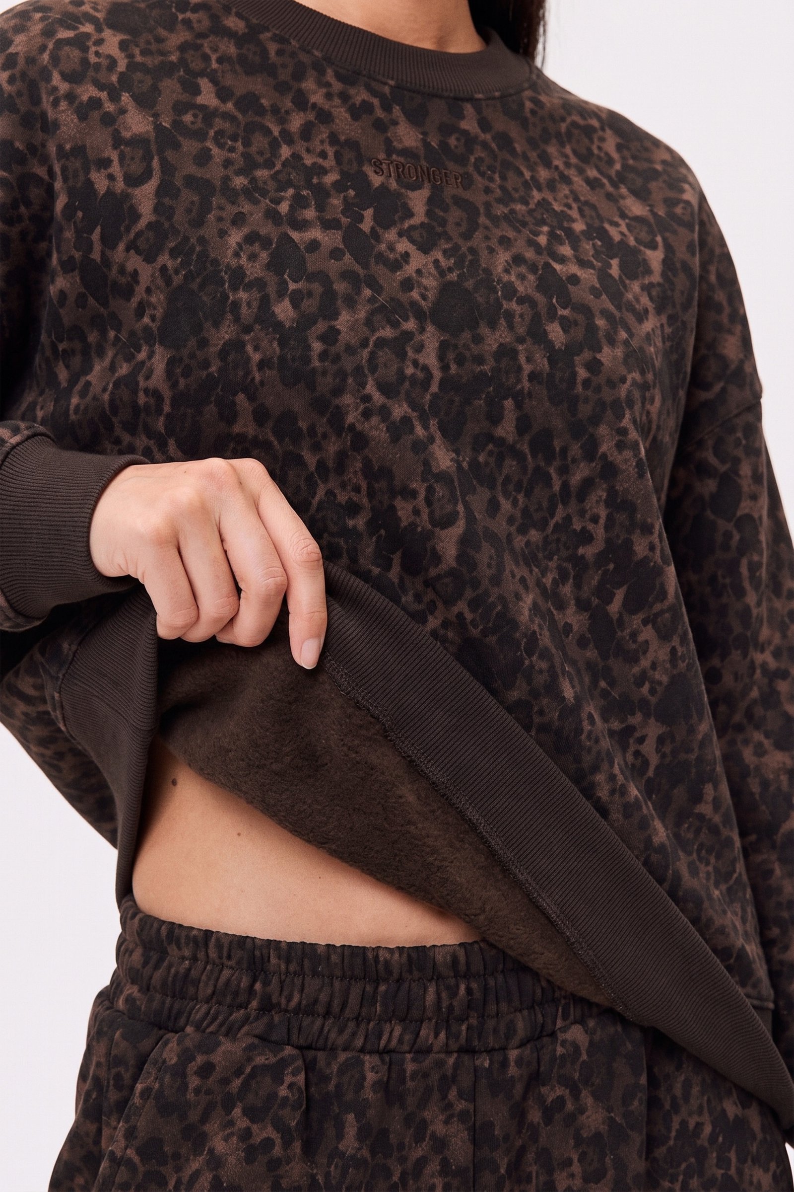Close-up of the soft, brushed inside of the Relaxed Sweatshirt in Dark Leo from stronger, showcasing the cozy material.
