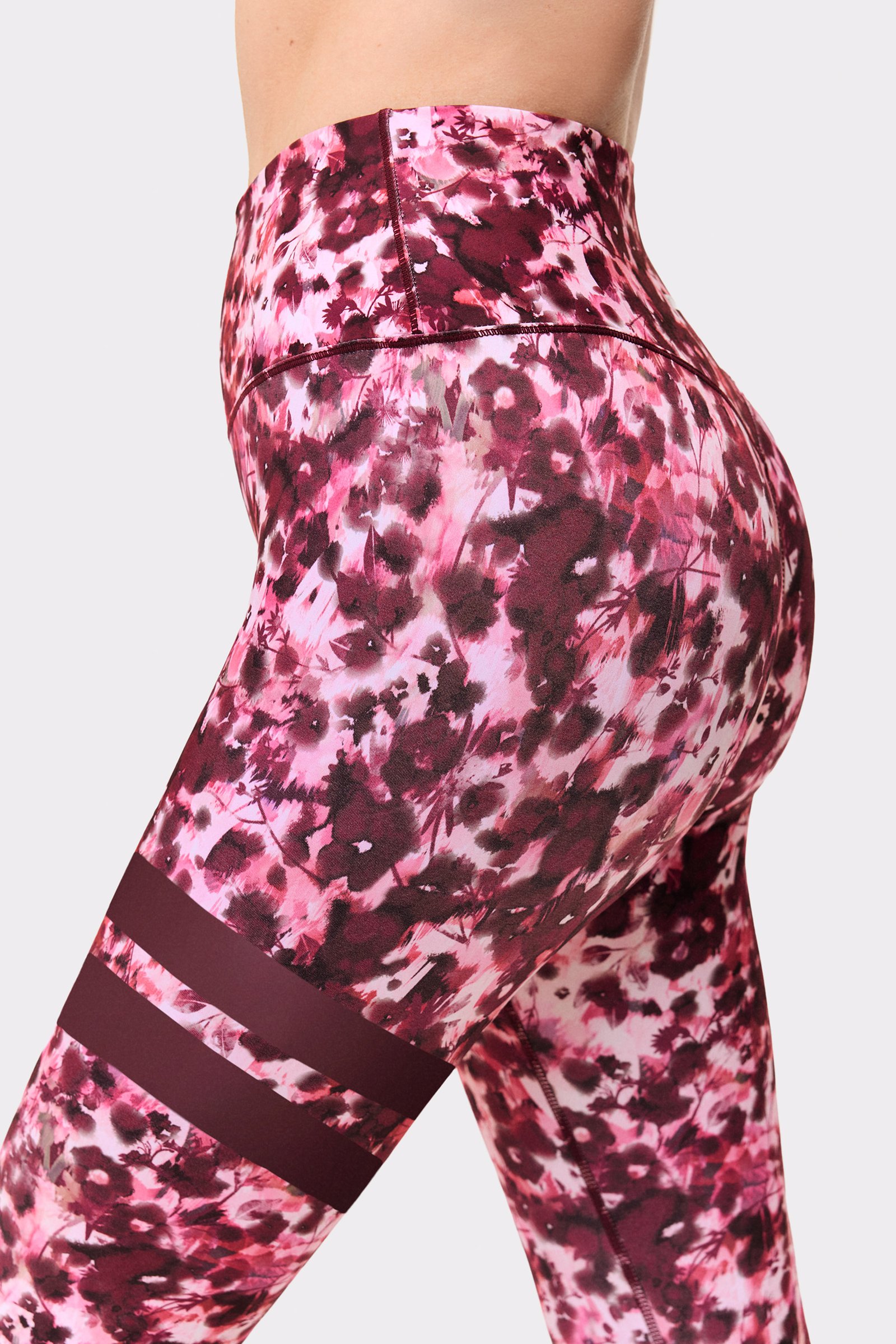 Close-up of Stronger The Signature One Leggings in Autumn Petals, showing the high waist and leg stripes.