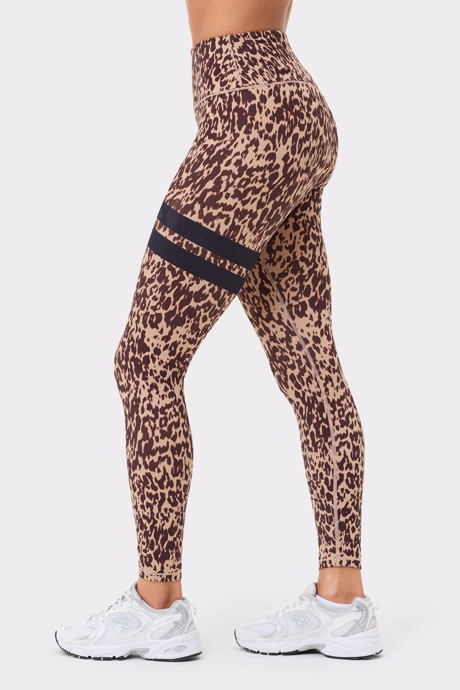 Stronger's The Signature One Leggings in light brown Leo Rush print, featuring black signature stripes in a side view.