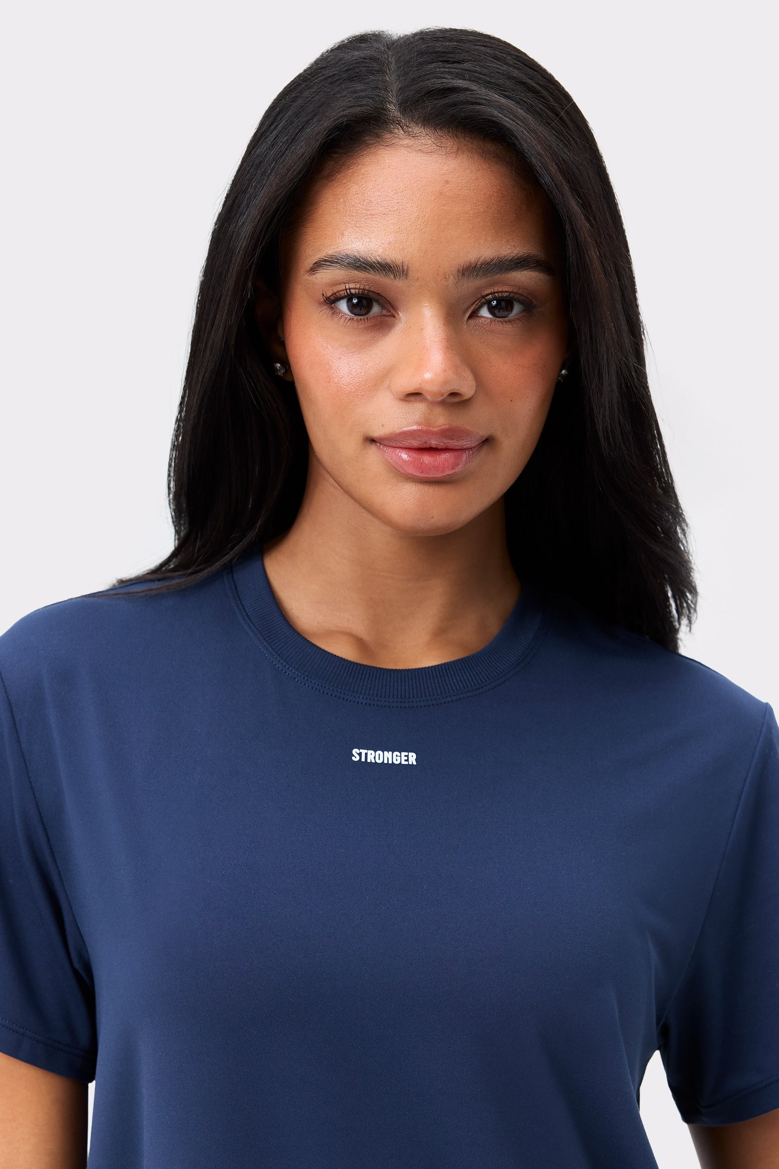 Dark blue Relaxed Tee by Stronger, featuring a centered white logo on the chest and a classic crew neck.