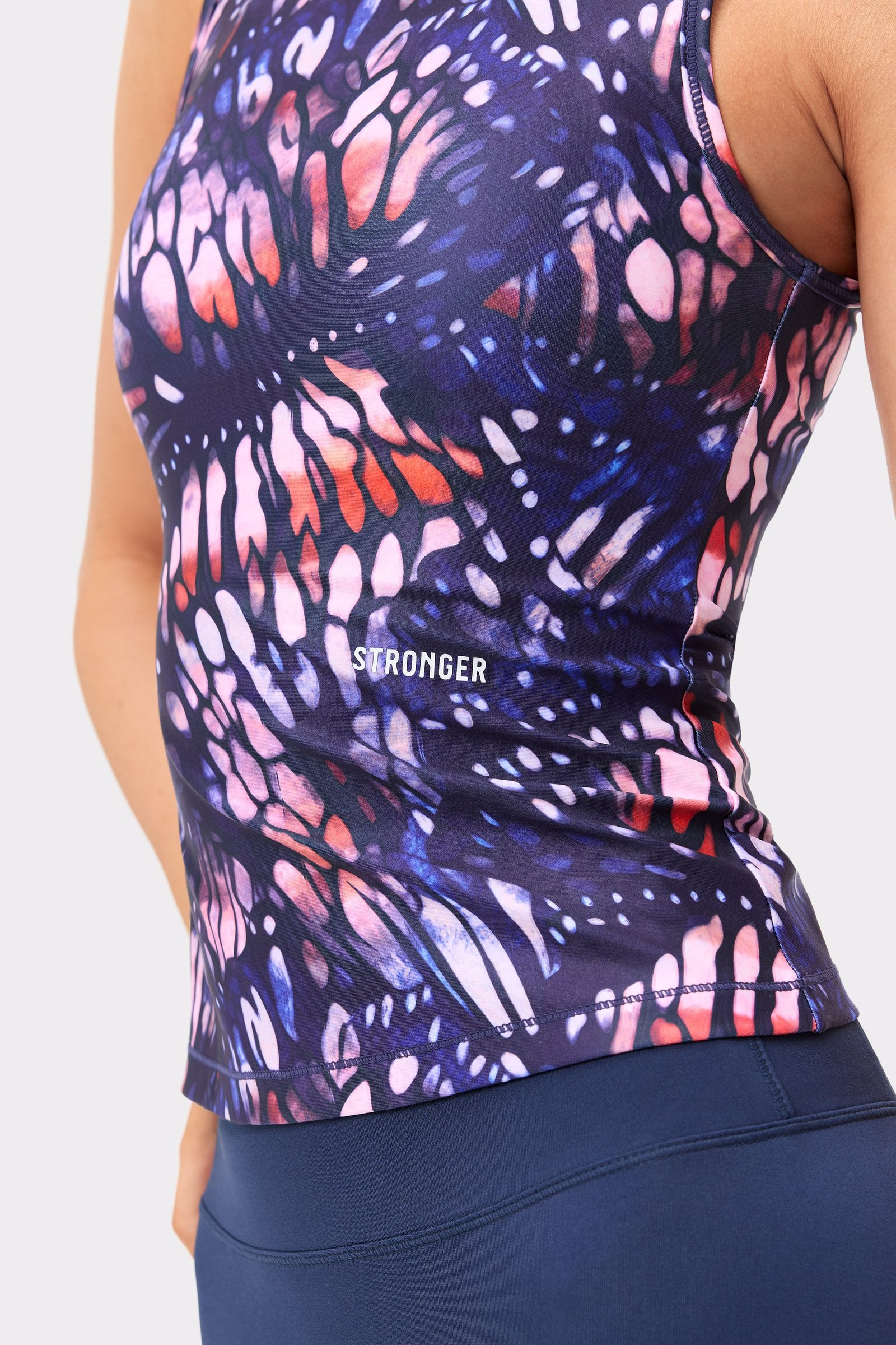 Stronger Signature Slim Tank Top in a dark pink butterfly print, featuring a streamlined slim fit and side logo.