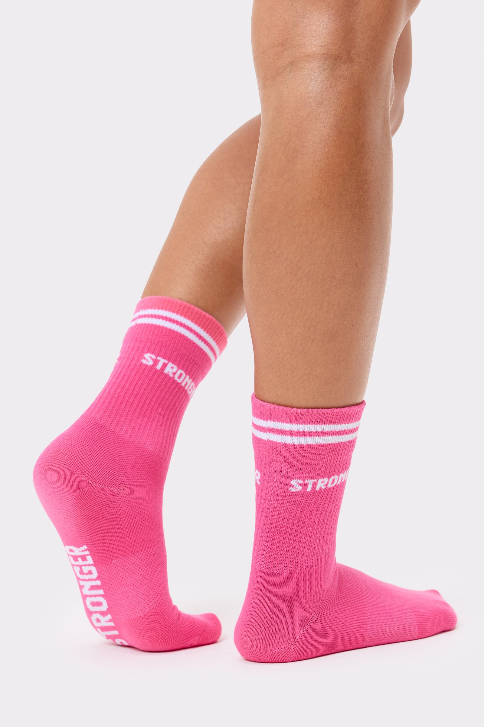 Fandango Pink Essential Socks 2-pack by Stronger, featuring white signature stripes and a knitted logo on crew-length cotton.