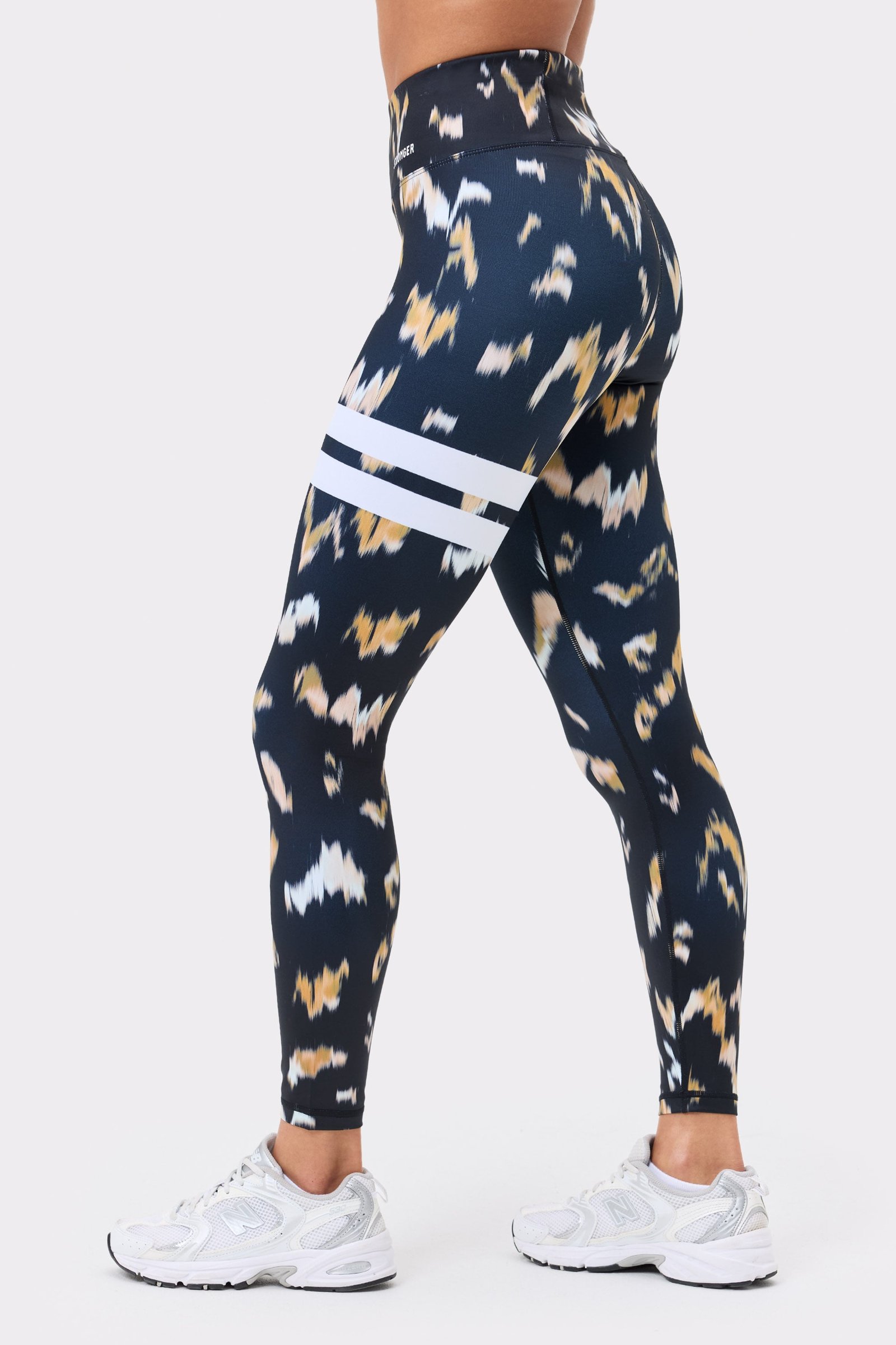 Stronger Explore Printed Leggings in Savannah Print featuring signature white stripes and high-waisted fit.
