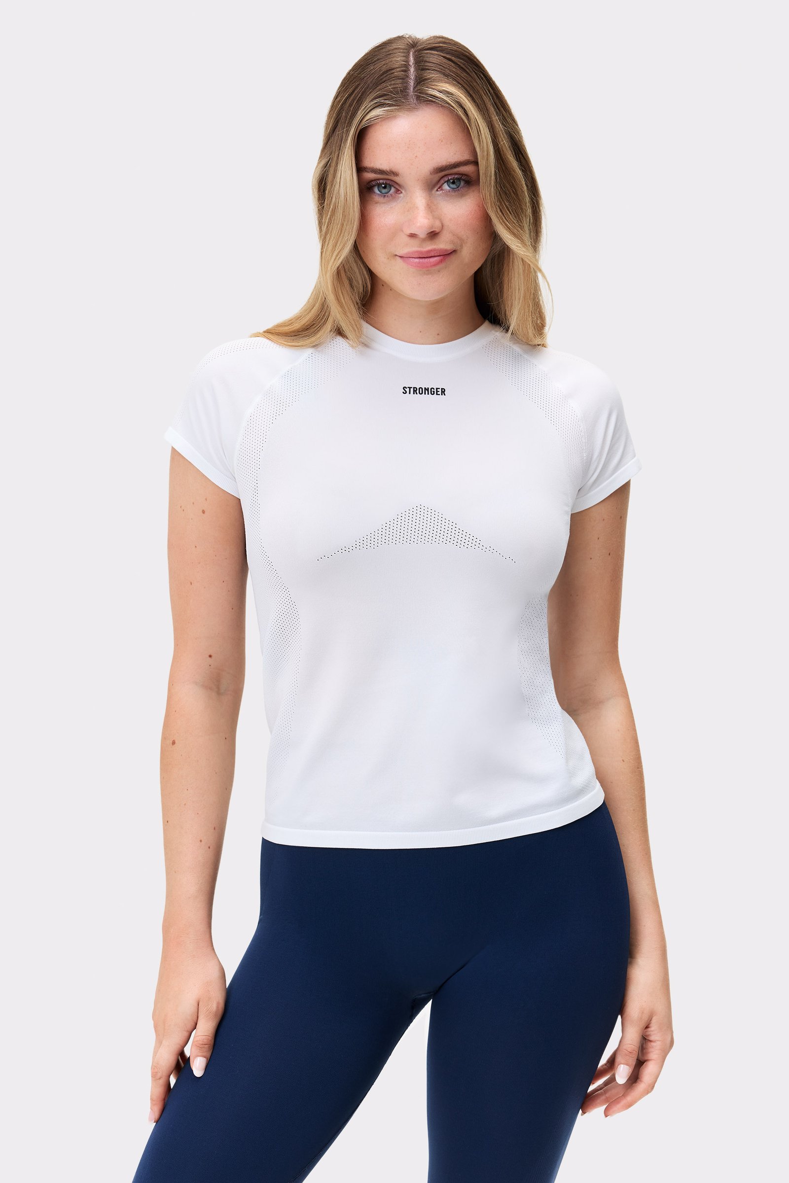 Slim-fit white Seamless Performance T-shirt by Stronger, featuring breathable knit patterns and a central chest logo.